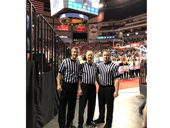 Sen. Barry DeKay, center, with fellow referees Matt Hager, left, and Preston Foster at the Pinnacle Bank Arena in Lincoln before the 2019 NSAA Class A girls state basketball final.
